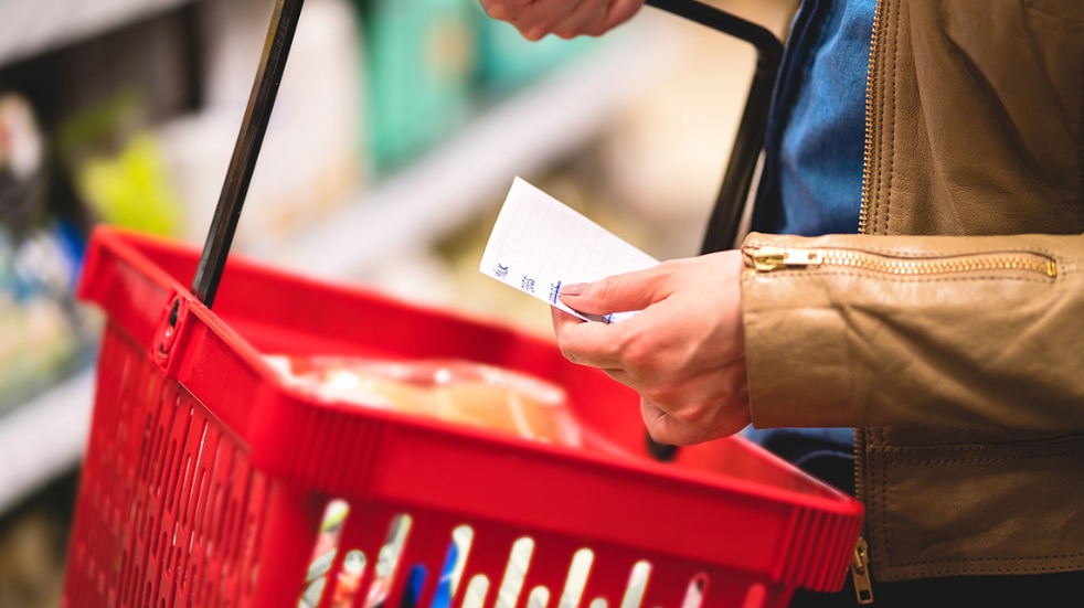 woman with a basket full of shopping